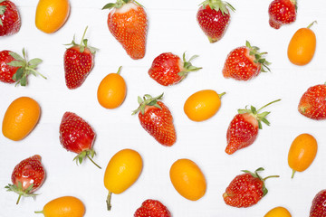 Fototapeta na wymiar Strawberries and oranges