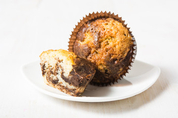 Two colored muffin in paper form
