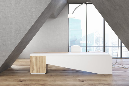 Gray triangular office, white table