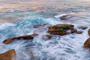 Water flow into coastal rocks.