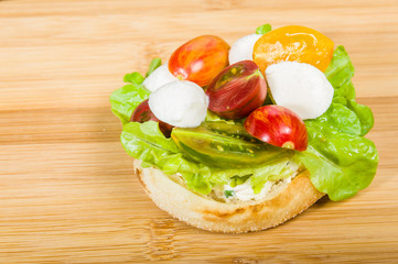 English muffin with heirloom tomatoes