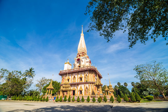 Pagoda at Wat Chalong or Chalong temple blue sky background