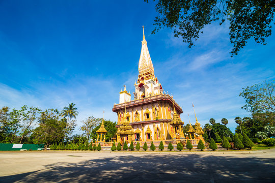 Pagoda at Wat Chalong or Chalong temple blue sky background