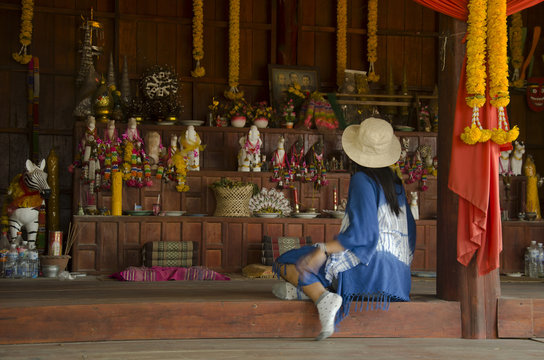 Thai women people visit and respect shrine of Phi Kon Nam or tradition of ghost carriage water at Ban Nasao in Chiang Khan