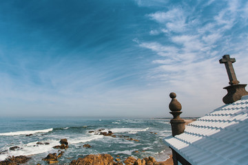 Chapel Senhor da Pedra at Miramar Beach, Atlantic ocean, Porto, Portugal.