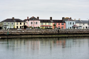 Fototapeta na wymiar Buildings lining a portion of Dungarvan Harbor in Dungarvan, County Waterford, Ireland.
