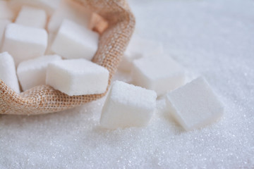 White cube sugar on granulated sugar. These are the nutritive sweeteners. sucrose or table sugar...