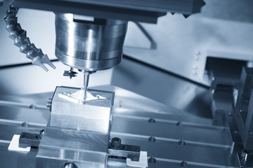 The CNC machine cutting work piece The hi-quality machining process concept.