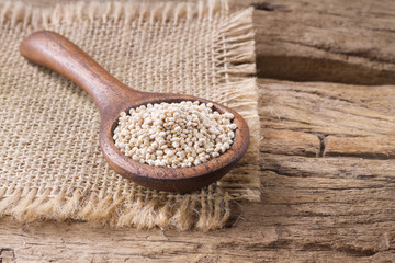 Grains of quinoa on wood - Chenopodium quinoa