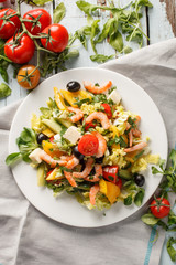Fresh summer salad with feta cheese and shrimps
