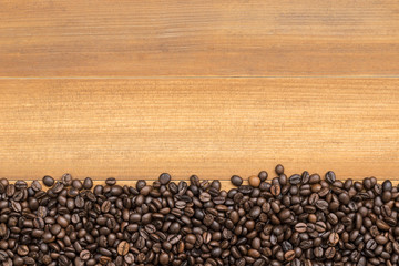 row of coffee beans isolated on white background