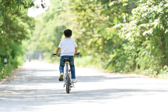 Young boy ride bicycle