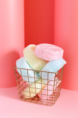 Colorful cotton candy on a pink pastel background. Minimal concept. 