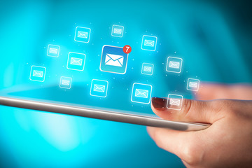 Fingers touching tablet with mail