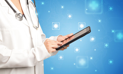 Female doctor with tablet