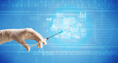 Female doctor holding syringe