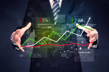 Businessman holding stock data