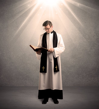 young priest in giving his blessing