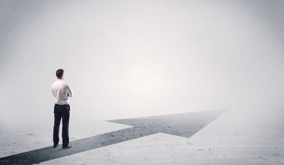 Standing salesman looking ahead with arrow