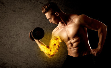 Muscular bodybuilder lifting weight with flaming biceps concept
