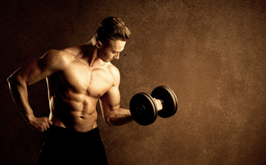 Fototapeta na wymiar Muscular fit bodybuilder athlete lifting weight