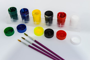 Poster Color and Paintbrush on the white screen