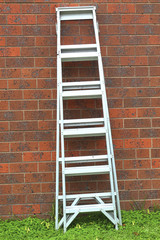 Aluminum ladder against the wall.