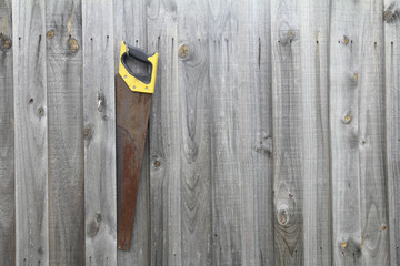 rake raking grass clippings, garden tools, rake hanging on a wooden floor.