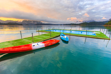 Tropical resort. Poolside with beautiful lake view