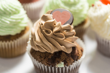 Some muffins cupcakes handmade on a white plate