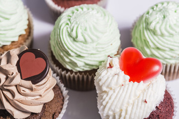 Some muffins cupcakes handmade on a white plate