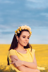 Summer Woman with Roses Wreath in a Field of Flowers