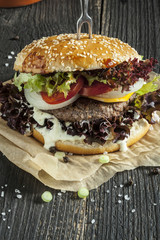 Delicious fresh homemade american burger on wooden table