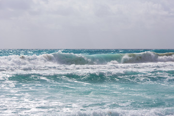 Powerful sea is showing it's power. Big waves on the shore.