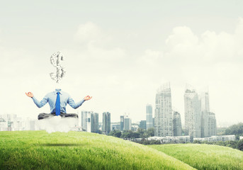 Headless meditating businessman