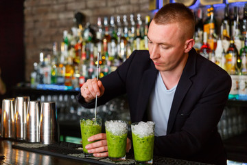 The bartender making vitamin cocktail