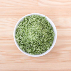 herbal salt from wild garlic / Porcelain bowl with green herbal salt of wild garlic
