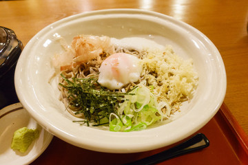 Cold soba ( buck wheat noodles ) with a soft boiled egg at a restaurant in Kyoto, Japan