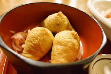 Inari-zushi ( cone sushi, sushi wrapped in fried tofu) an a restaurant in Kyoto, Japan