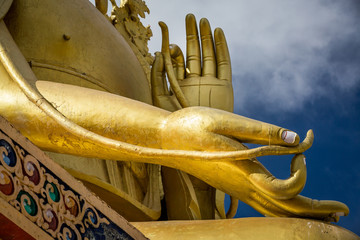 Hands of the giant golden statue of Future Buddha at Likir Monastery in the Indian Himalaya. Likir, Ladakh, India - obrazy, fototapety, plakaty
