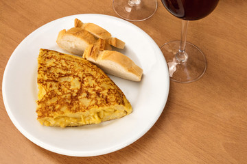 Spanish tortilla with wine, tapas in a bar