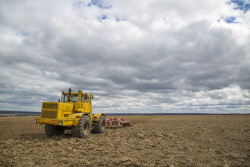 Tractor in a field in Russia