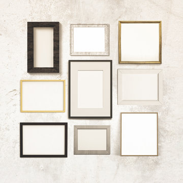 gallery of frames hanging on a grunge wall