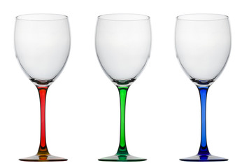 Empty wine glasses with red, blue and green foot isolated on white background