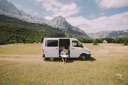Woman on road trip checking the map