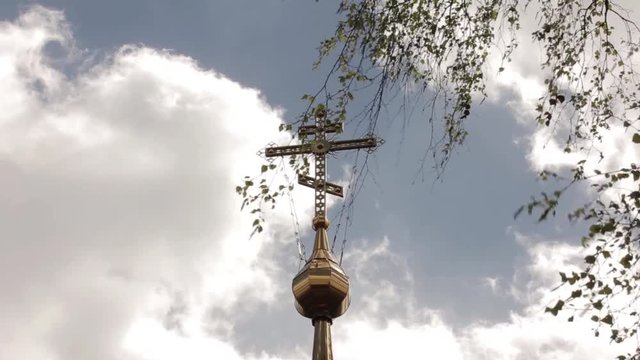 Orthodox cross on a church on a sky background