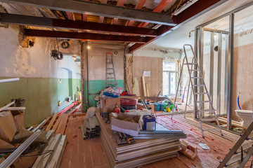 Obraz na płótnie Canvas Interior of apartment with materials during on the renovation and construction ( remodel wall from gypsum plasterboard or drywall)