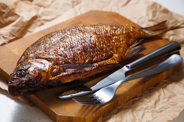 Smoked fish on the wood cutting board