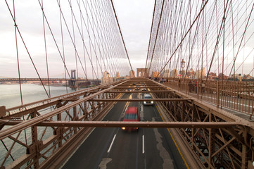 Naklejka premium part of brooklyn bridge in New York at sunset