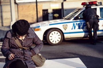 Woman on Manhattan Bench with Phone